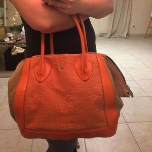 Pour La Victoire orange bag